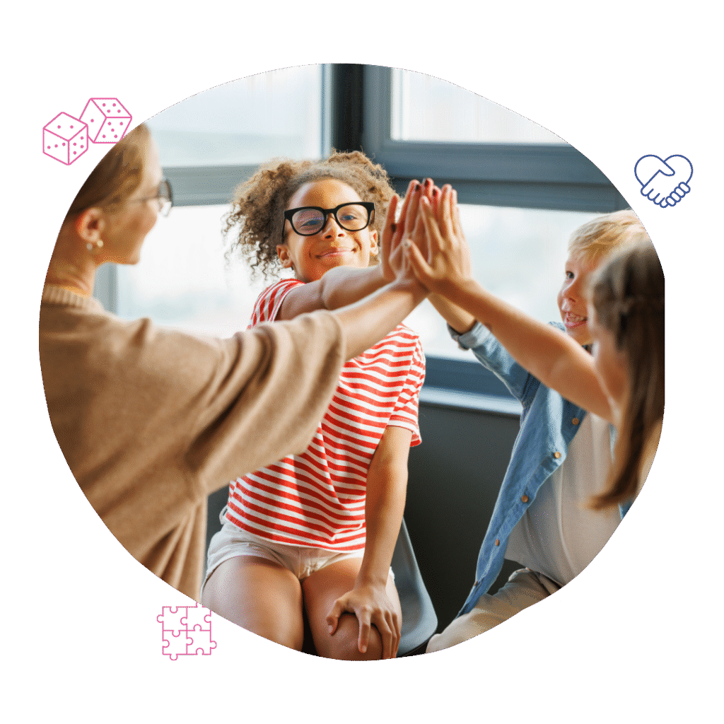 Children participating in a group high-five during a session with Your Best Life Behaviour Support